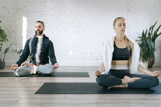 Image of a person practicing yoga indoors, creating a calm and peaceful atmosphere to enhance mental well-being and relaxation