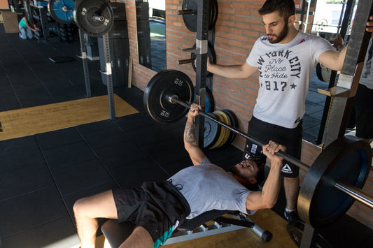 Personal Trainer guiding a client through an exercise