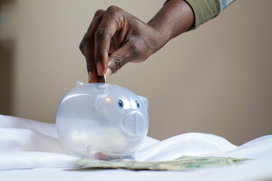 Image of a piggy bank and coins, illustrating the concept of savings and financial stability