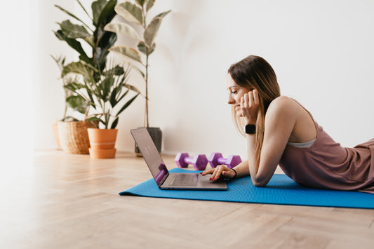 woman doing workout at home and looking for some online workout videos