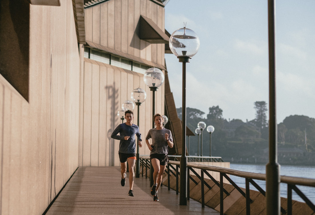 Two individuals engaged in a morning run, showcasing an active and healthy lifestyle