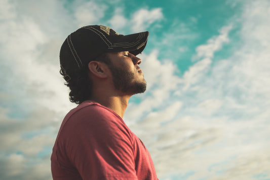 Image of a man engaged in mindfulness, practicing presence and connection during his workout.