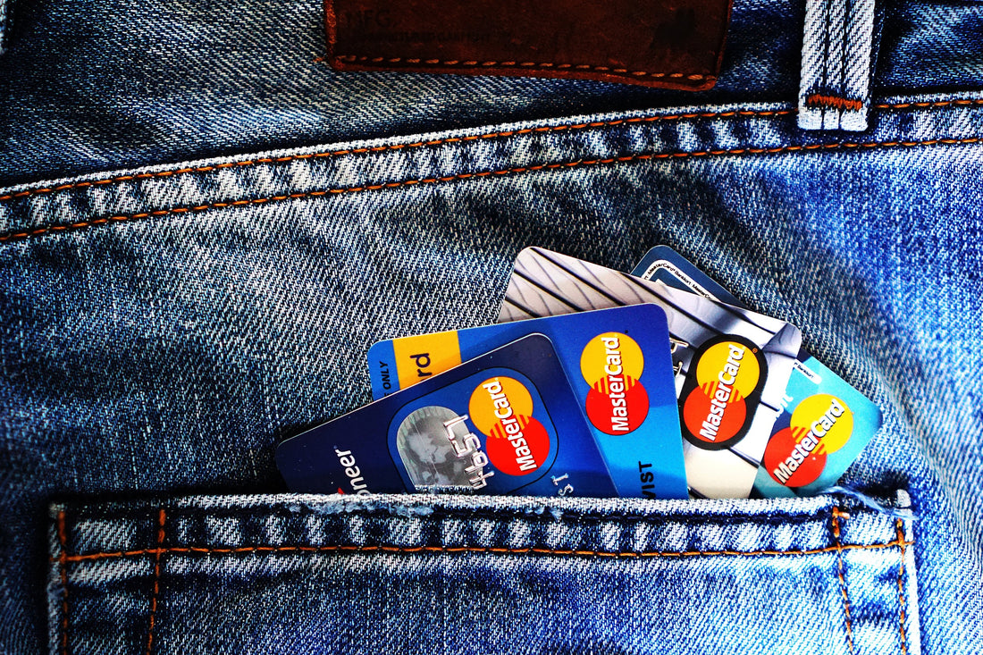 Credit cards neatly stacked in a pocket, symbolizing financial tools for transactions and credit score impact