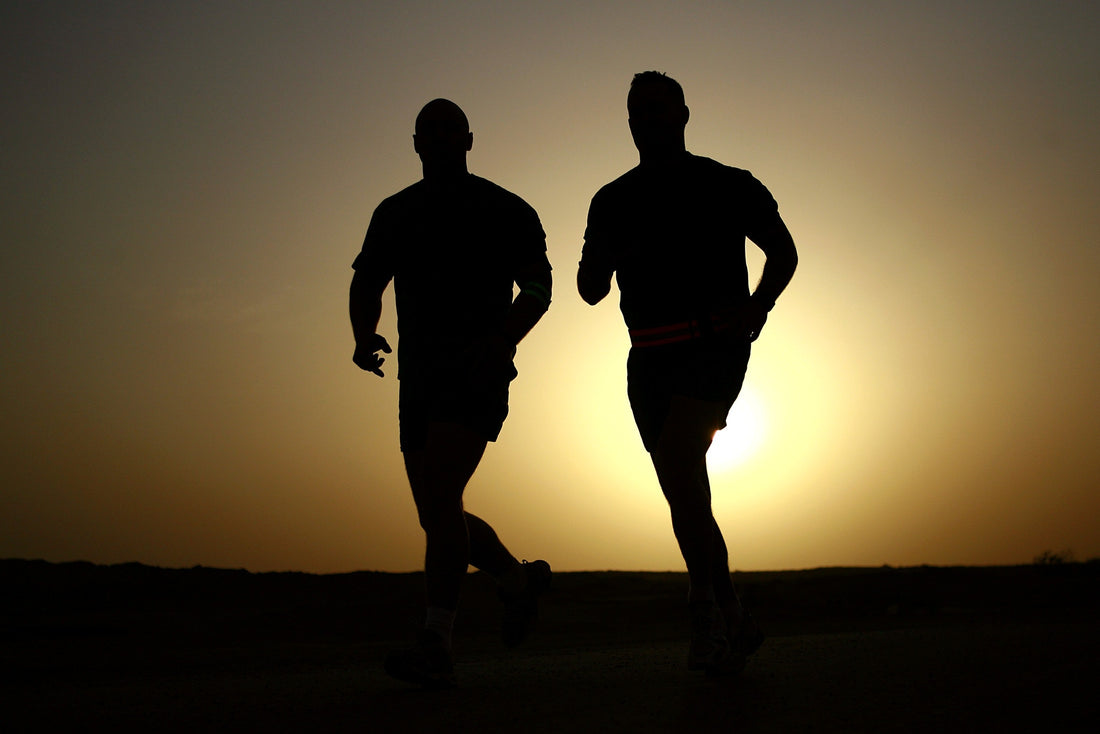 two fit healthy men running