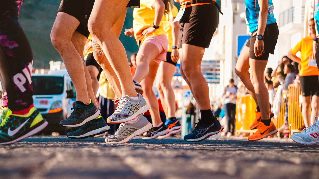 Close-up of feet in running shoes, poised to pound the pavement on a fitness journey or outdoor adventure.