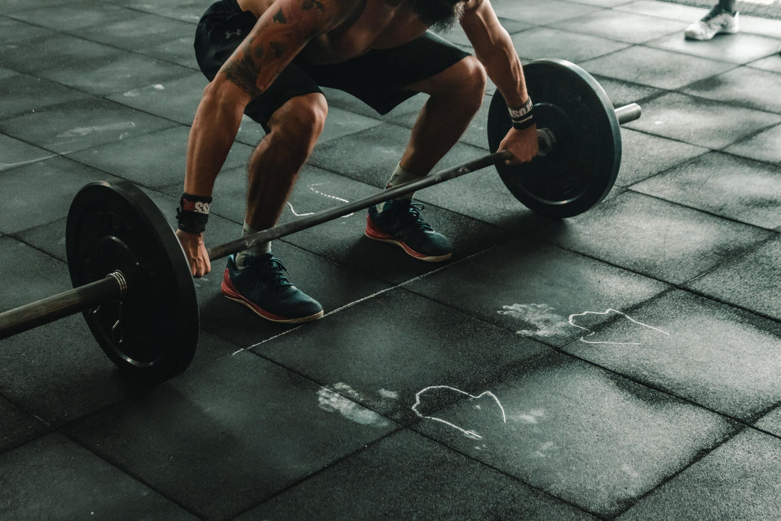 Man Holding a Barbell during Weightlifting Session